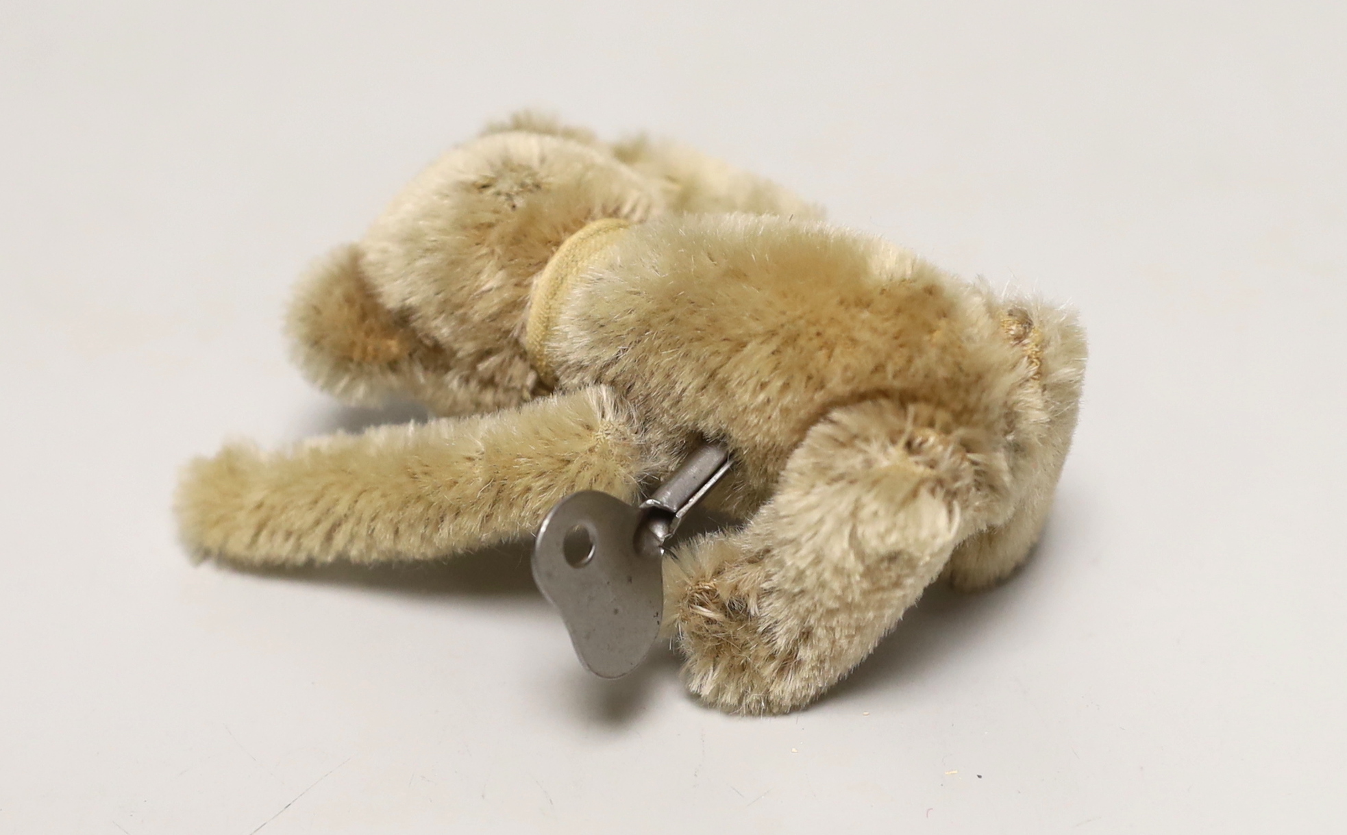 A Schuco tumbling bear with key, c.1950. 5in., excellent condition